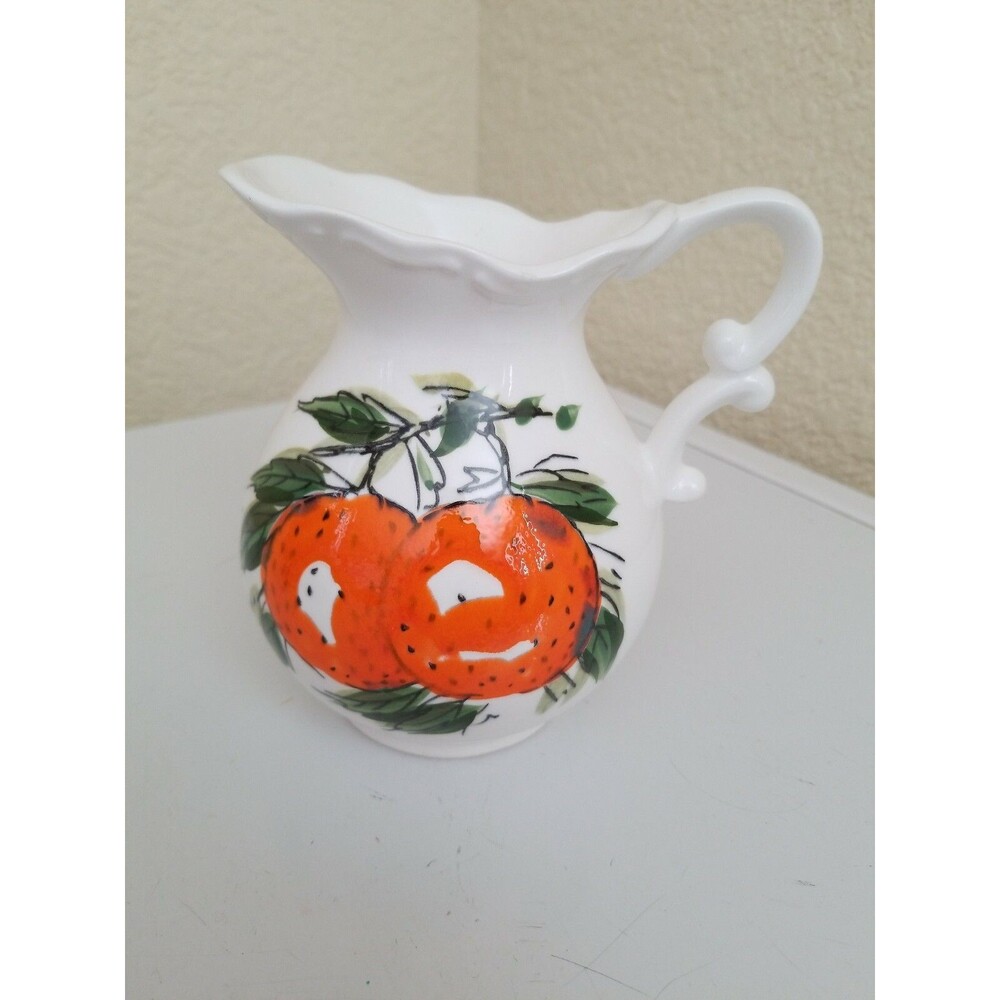 Vintage milk/water pitcher..made in Japan. Beautiful bright oranges...